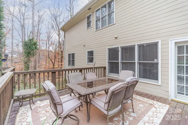 a view of a chair and table in the balcony