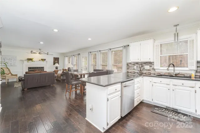 a kitchen with lots of counter top space and living room