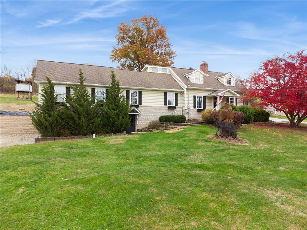 1512 Abers Creek Road Pittsburgh, PA 15239 - Photo 1 of 39 a front view of a house with a yard