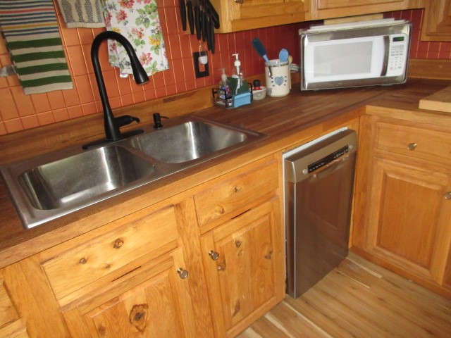 90 Riverside Lane Irvine, PA 16329 - Photo 16 of 47 New SS sink and faucet with new Bosch dishwasher and butcher block counter top