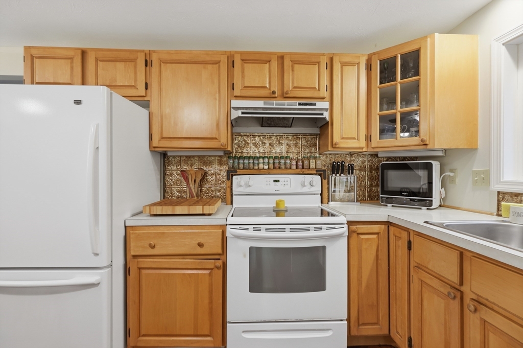 60 Petersham Road Phillipston, MA 01331 - Photo 12 of 33 a kitchen with a stove top oven sink and refrigerator