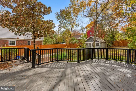 a view of a patio with furniture and a potted plant