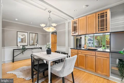 a kitchen with a table and chairs in it