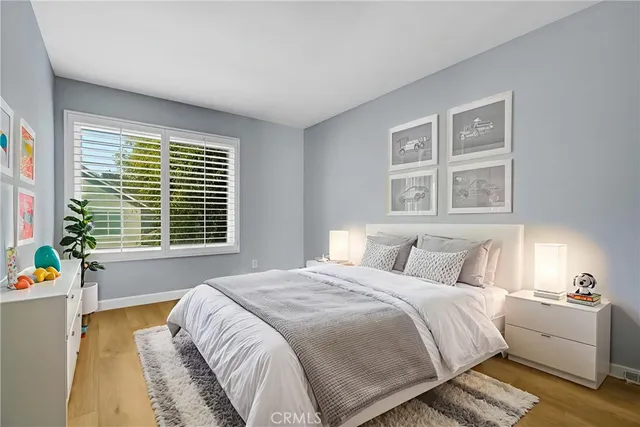 a bedroom with bed and a window