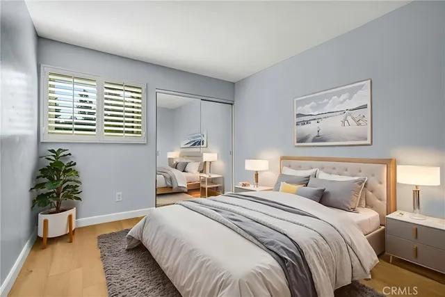 a bedroom with bed and a window