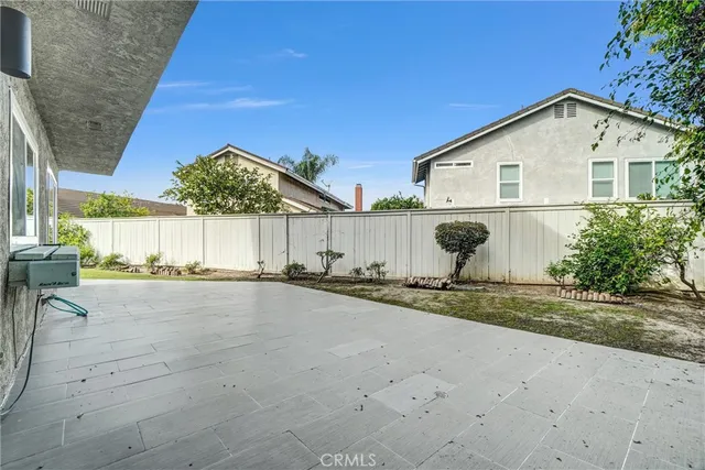a view of a house with a yard and sitting area