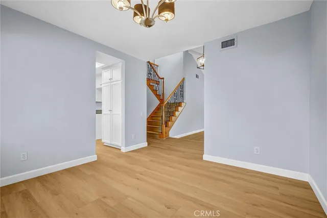 a view of an entryway with wooden floor
