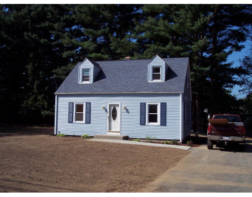 100 Slater Avenue Springfield, MA 01119 - Photo 2 of 12 a front view of a house with a yard and garage