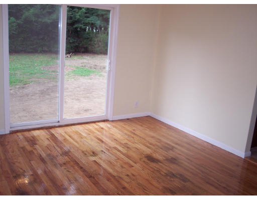100 Slater Avenue Springfield, MA 01119 - Photo 3 of 12 a view of an empty room and wooden floor