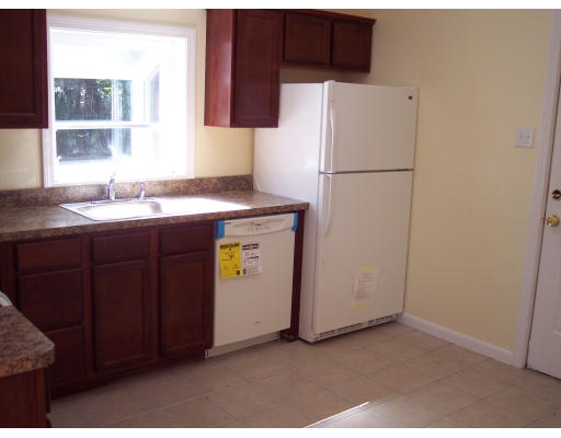 100 Slater Avenue Springfield, MA 01119 - Photo 6 of 12 a kitchen with a refrigerator and a sink