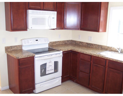 100 Slater Avenue Springfield, MA 01119 - Photo 7 of 12 a kitchen with granite countertop cabinets stove and oven