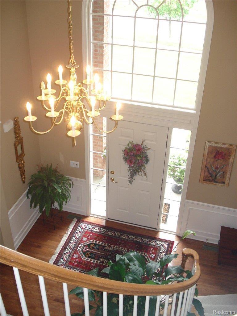 44632 Spring Hill Road Northville, MI 48168 - Photo 8 of 25 WINDING STAIRCASE IN FOYER