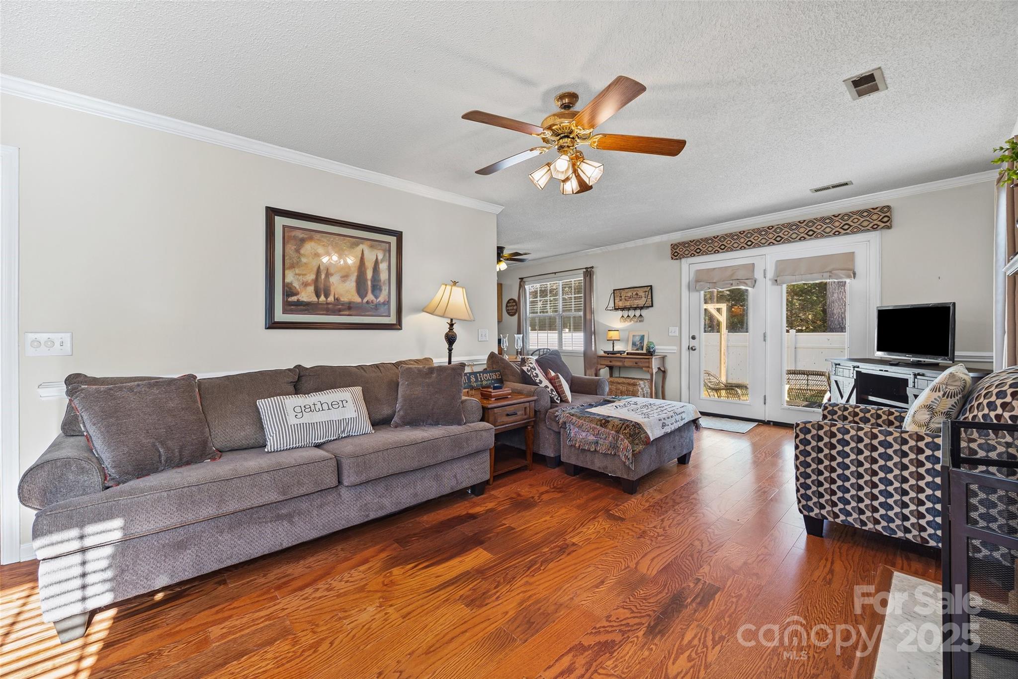 1337 Windsor Ridge Drive Rock Hill, SC 29732 - Photo 7 of 25 a living room with furniture a couch and a flat screen tv