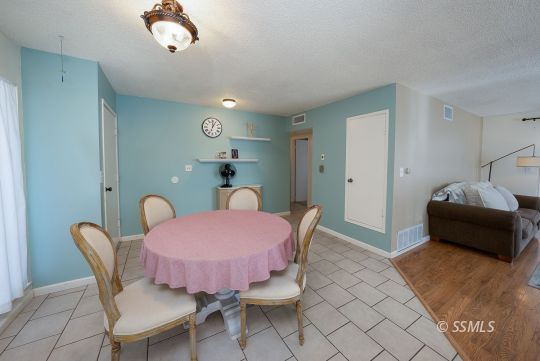 314 Lenore Street Ridgecrest, CA 93555 - Photo 7 of 29 a dining room with furniture and wooden floor