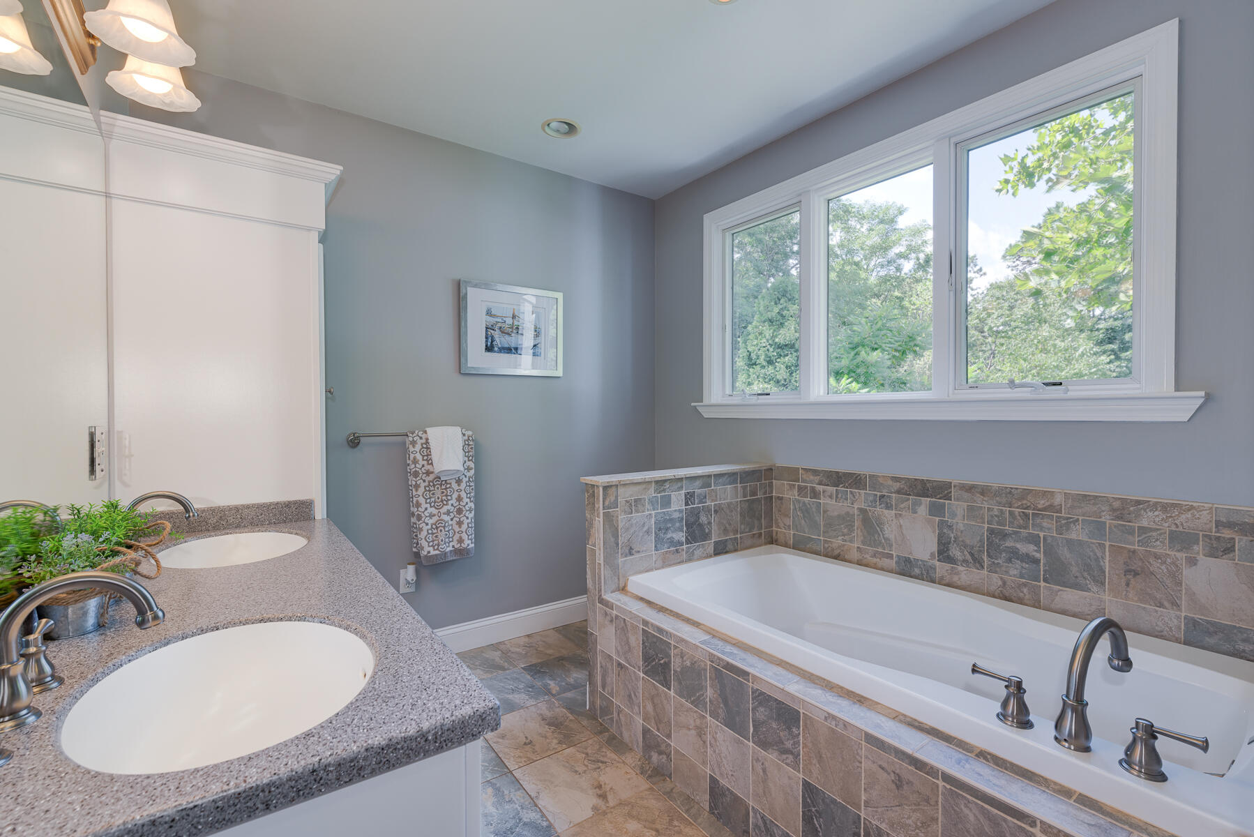 37 Whitmar Road Cotuit, MA 02635 - Photo 28 of 83 a bath tub sitting next to a bathroom sink and a mirror