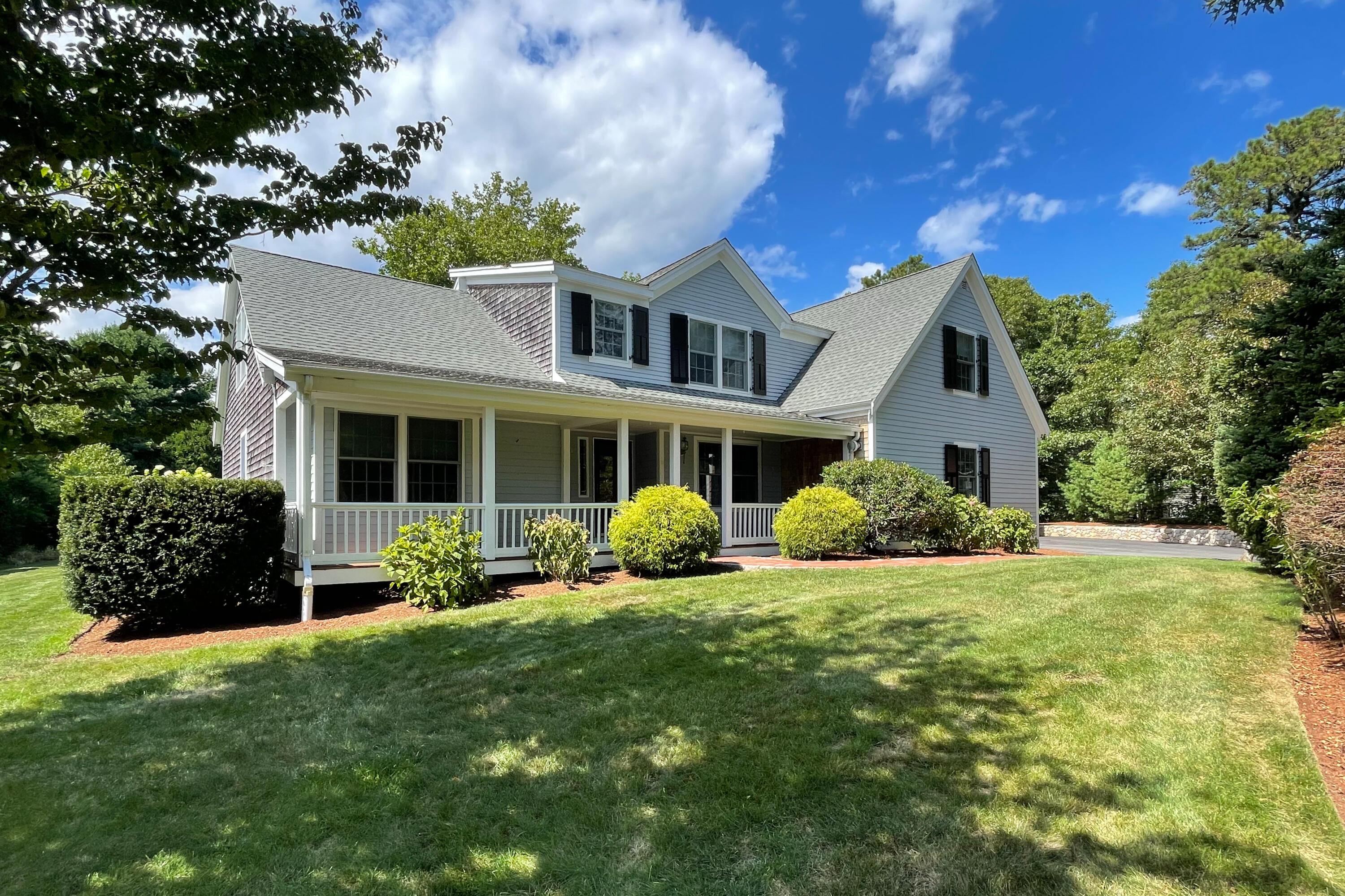 37 Whitmar Road Cotuit, MA 02635 - Photo 3 of 83 a front view of a house with a garden