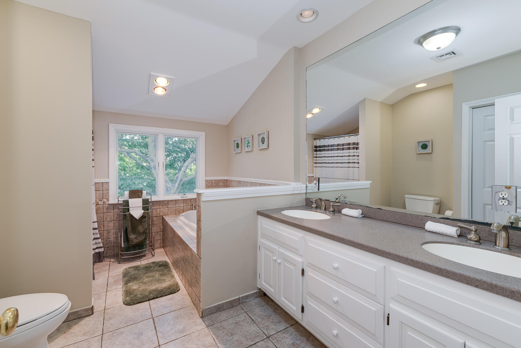 37 Whitmar Road Cotuit, MA 02635 - Photo 34 of 83 a bathroom with a double vanity sink toilet and a mirror