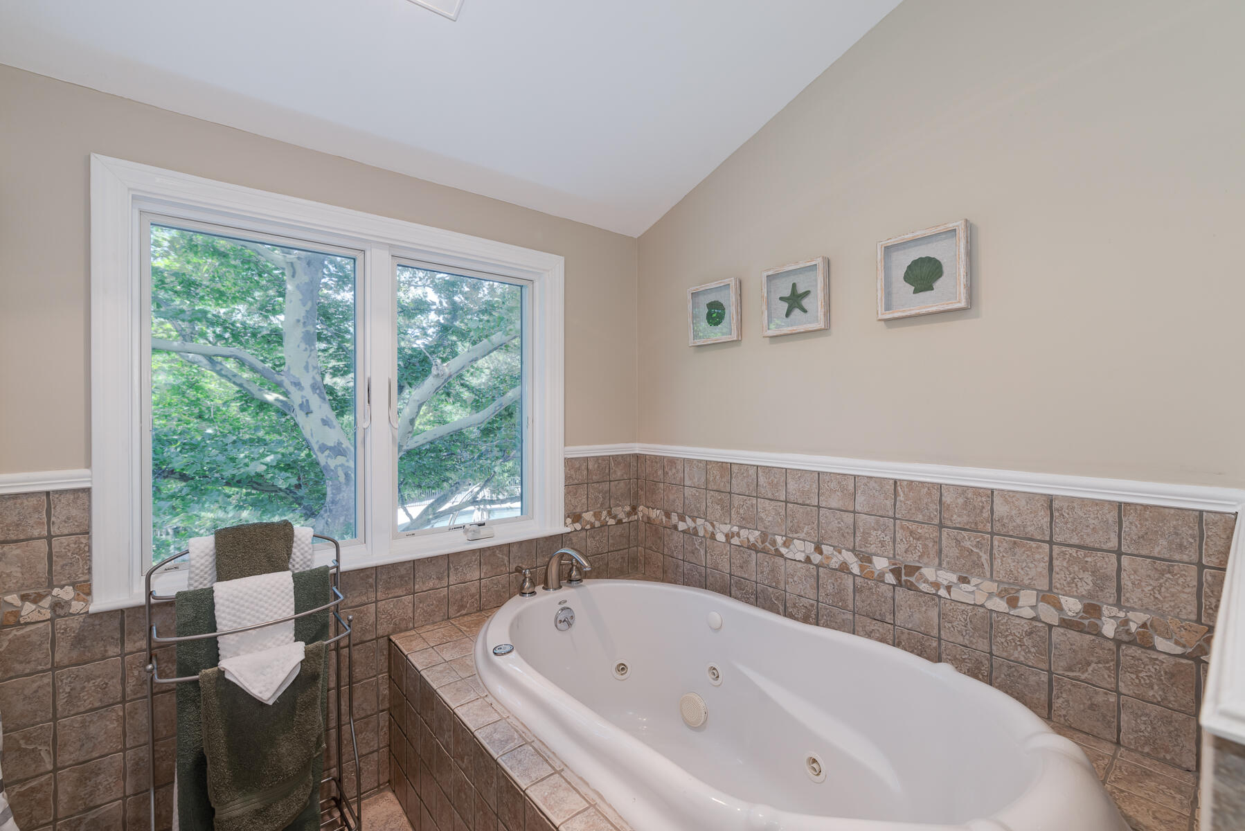 37 Whitmar Road Cotuit, MA 02635 - Photo 35 of 83 a bath tub sitting next to a window