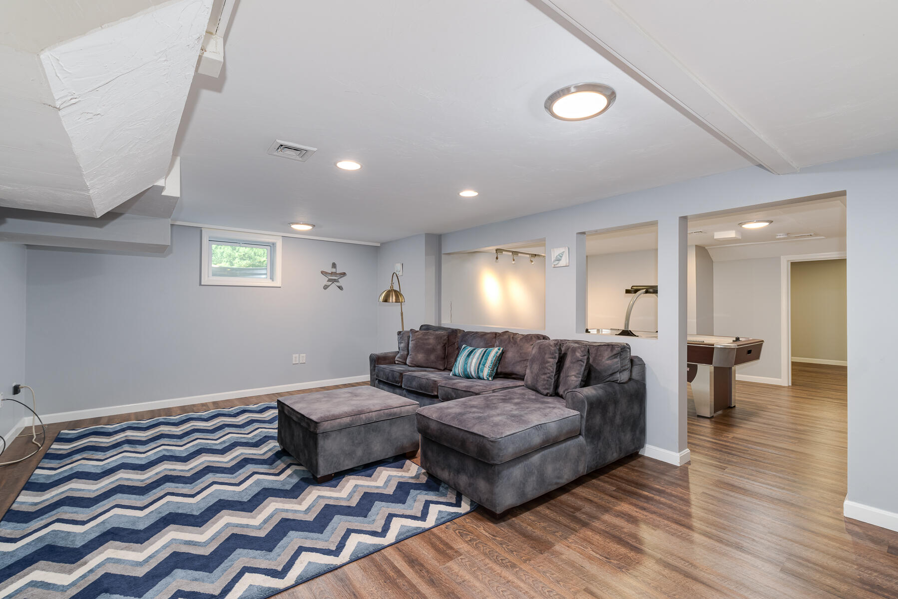 37 Whitmar Road Cotuit, MA 02635 - Photo 54 of 83 a living room with furniture and wooden floor