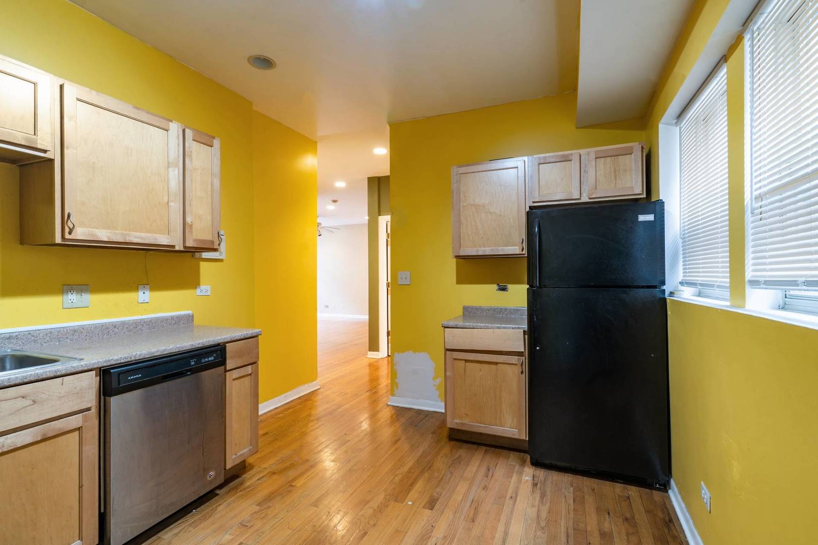 8154 South Drexel Avenue, Unit 2E Chicago, IL 60619 - Photo 11 of 15 a kitchen with a refrigerator and a sink