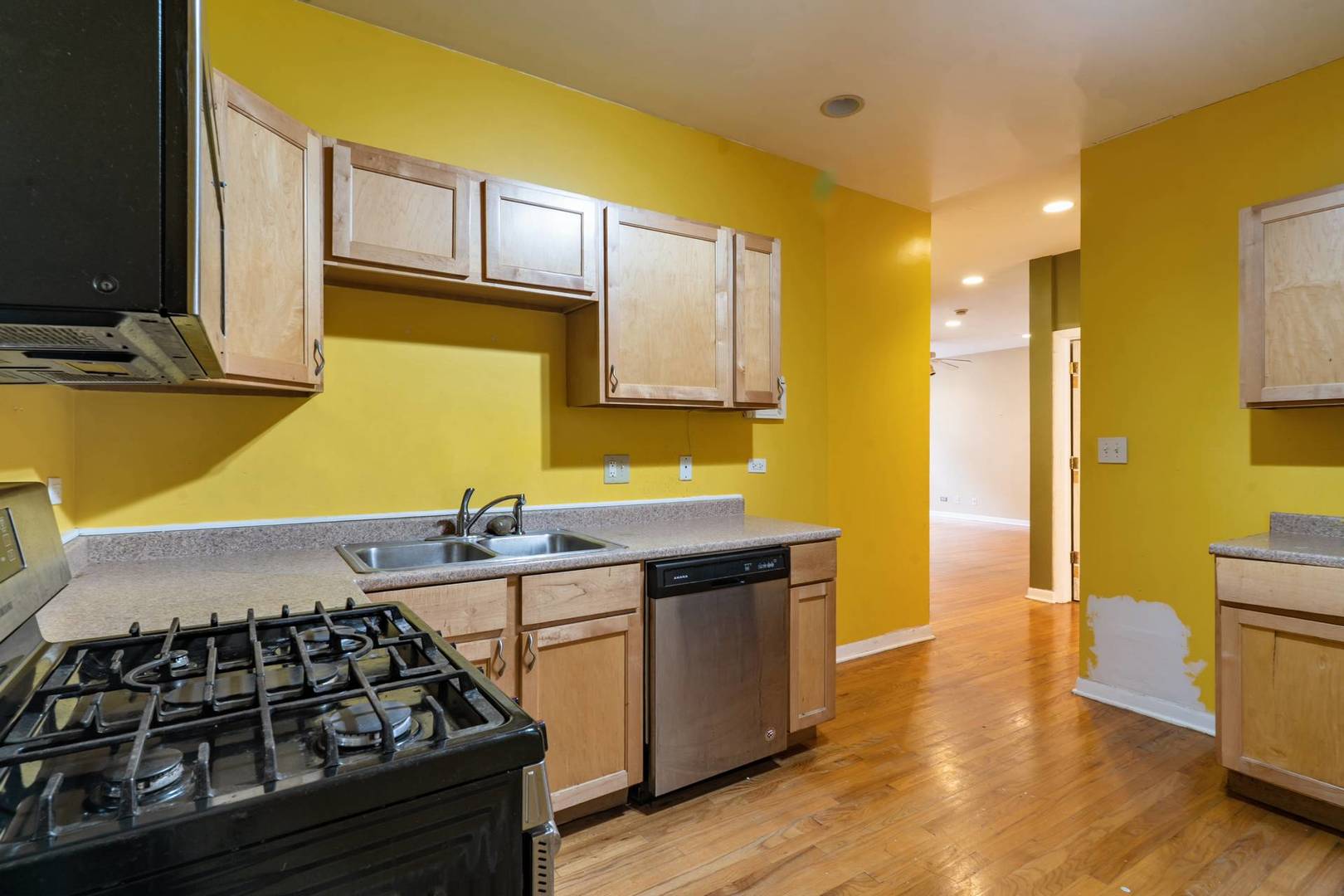 8154 South Drexel Avenue, Unit 2E Chicago, IL 60619 - Photo 12 of 15 a kitchen with a sink and wooden cabinets