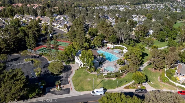 an aerial view of a house with a swimming pool