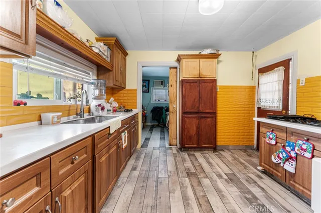 a kitchen with stainless steel appliances granite countertop a sink and cabinets