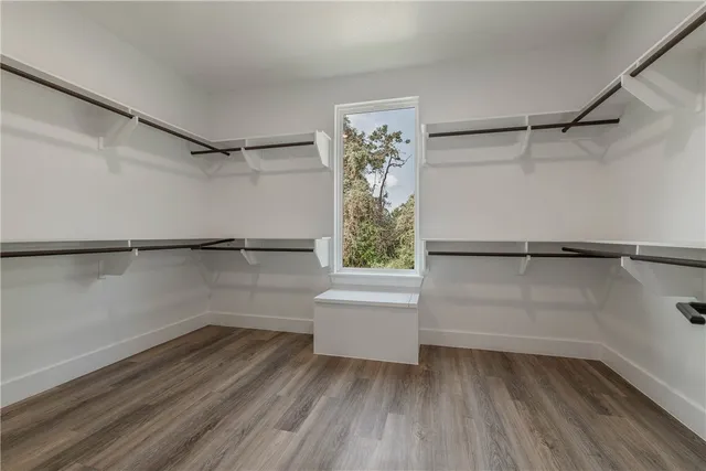 a view of backyard of house with green space