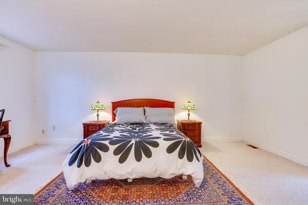 a bedroom with a bed and a table