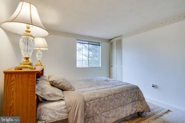 a view of a house with a big yard and large trees