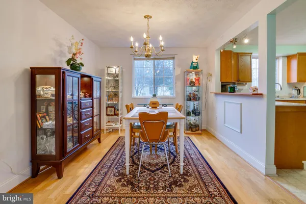 a view of a dining room with furniture and window