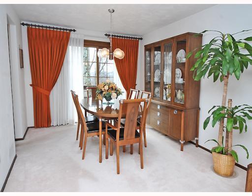 Dining Room. Neutral walls and carpeting. Double slider to rear deck.