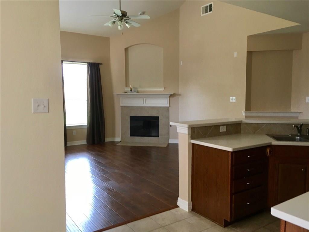 5720 Pebble Ridge Drive McKinney, TX 75070 - Photo 7 of 24 With Laminated floor you can see how the living room has changed compared with previous picture.