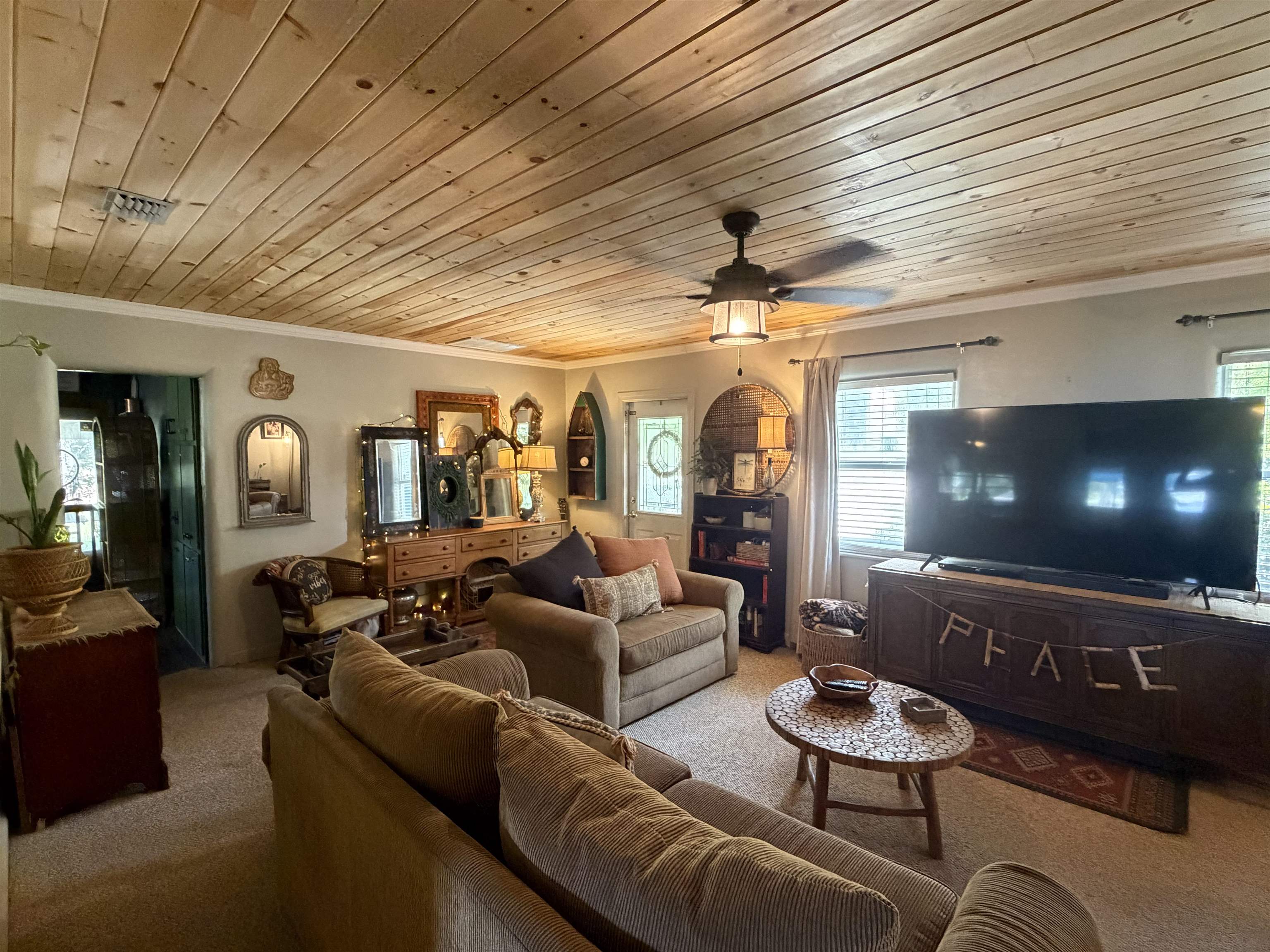 323 Sisco Road Pomona Park, FL 32181 - Photo 24 of 31 a living room with furniture and a wooden floor