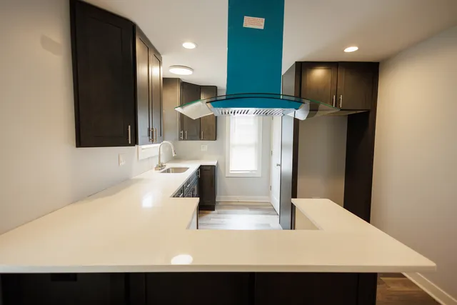 a kitchen with stainless steel appliances a refrigerator and a sink
