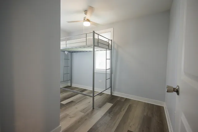 an empty room with wooden floor