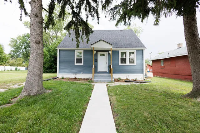 a front view of a house with yard