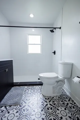 a bathroom with a sink vanity and a mirror