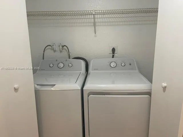 a utility room with dryer and washer