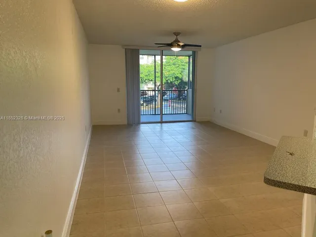 a view of an empty room with a fireplace
