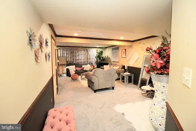 a bedroom with furniture and a flat screen tv