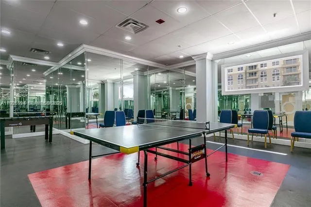 a dining hall with lots of tables and chairs