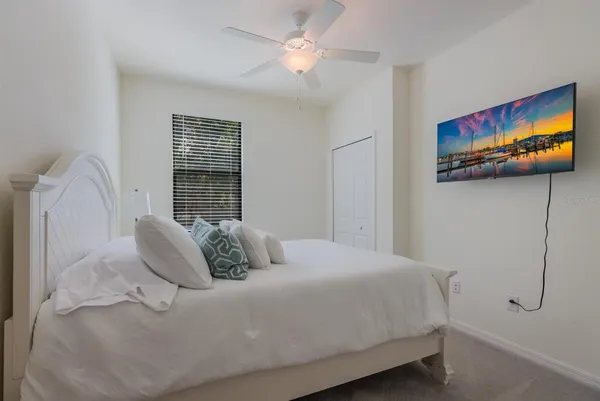 a bedroom with a bed and a cabinets
