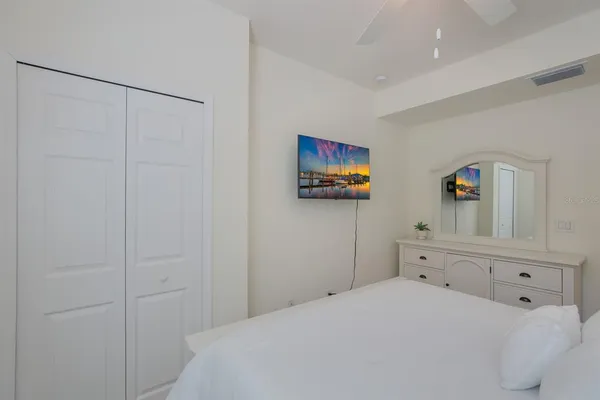 a bedroom with a bed and window