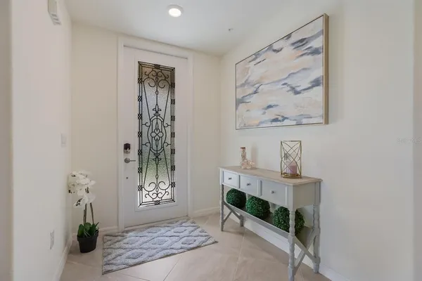 a view of a hallway with paintings on the wall