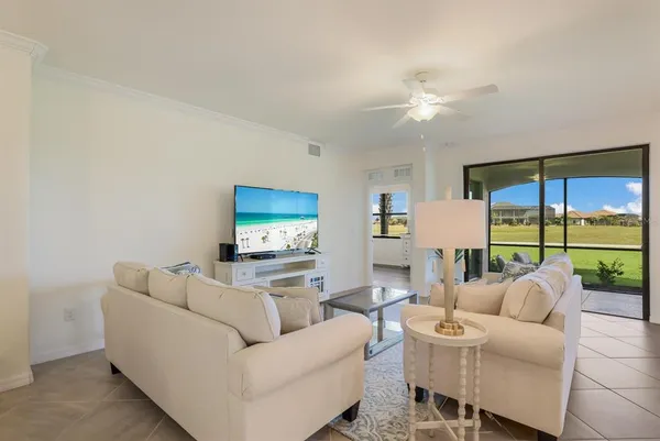 a living room with furniture and a large window