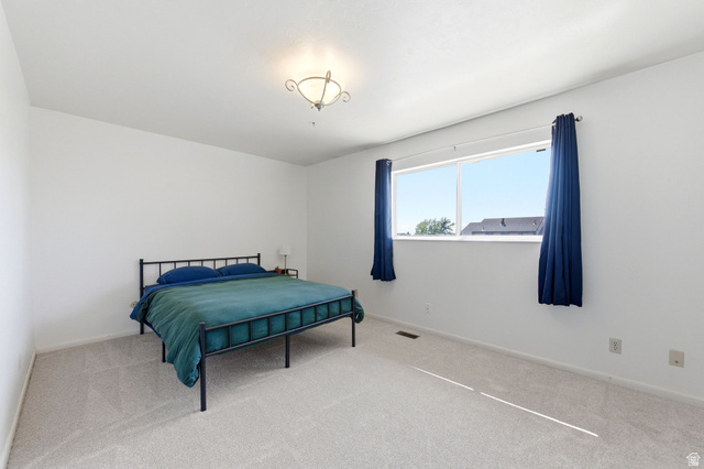 2632 North 140 West Sunset, UT 84015 - Photo 5 of 12 Bedroom featuring carpet and baseboards