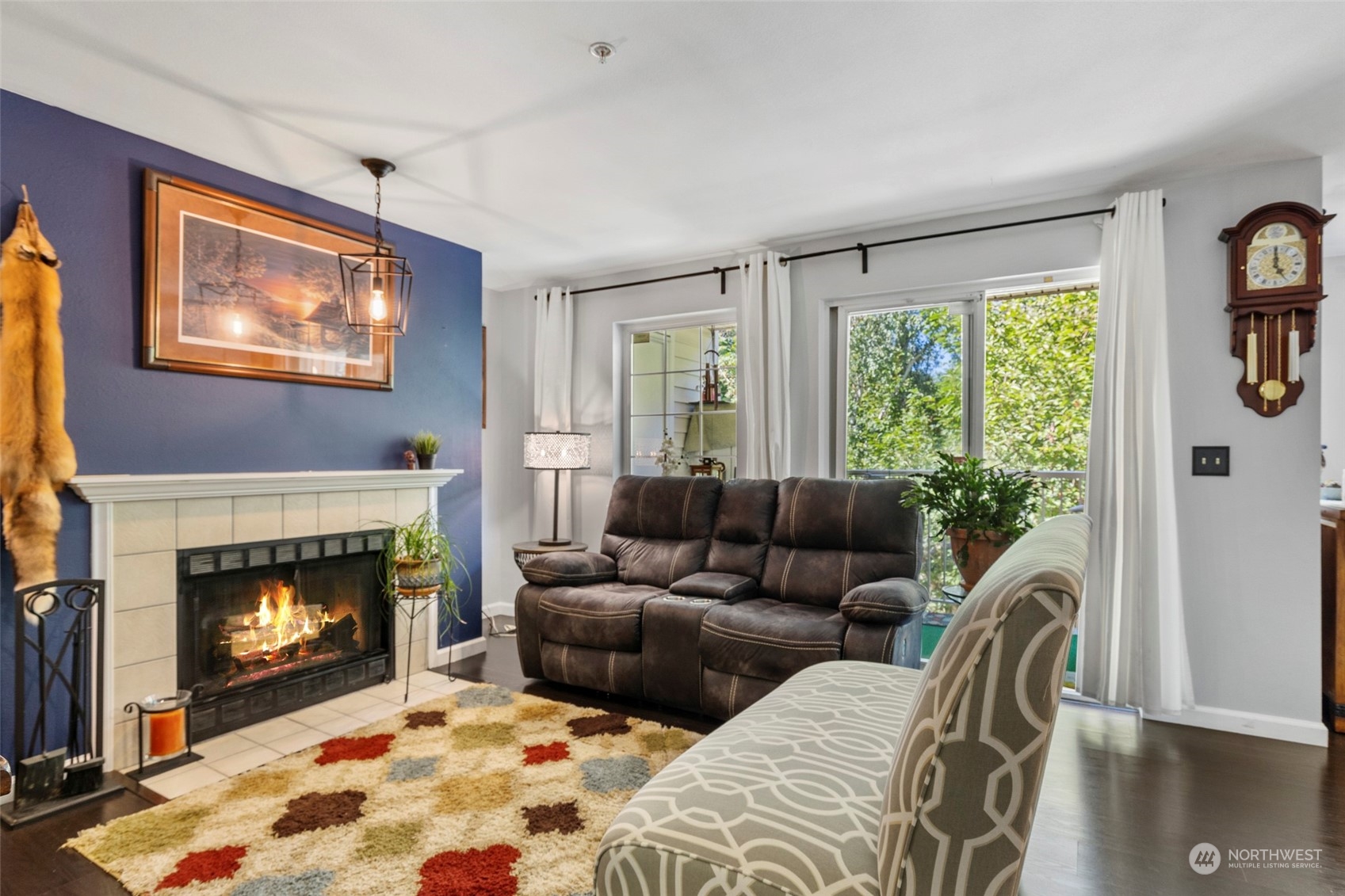 949 Aberdeen Avenue Northeast, Unit E216 Renton, WA 98056 - Photo 13 of 23 a living room with furniture and a fireplace