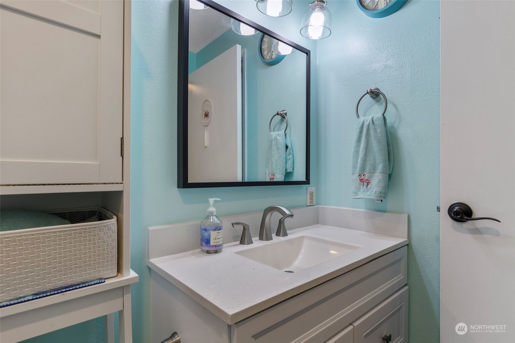 949 Aberdeen Avenue Northeast, Unit E216 Renton, WA 98056 - Photo 16 of 23 a bathroom with a sink and a mirror
