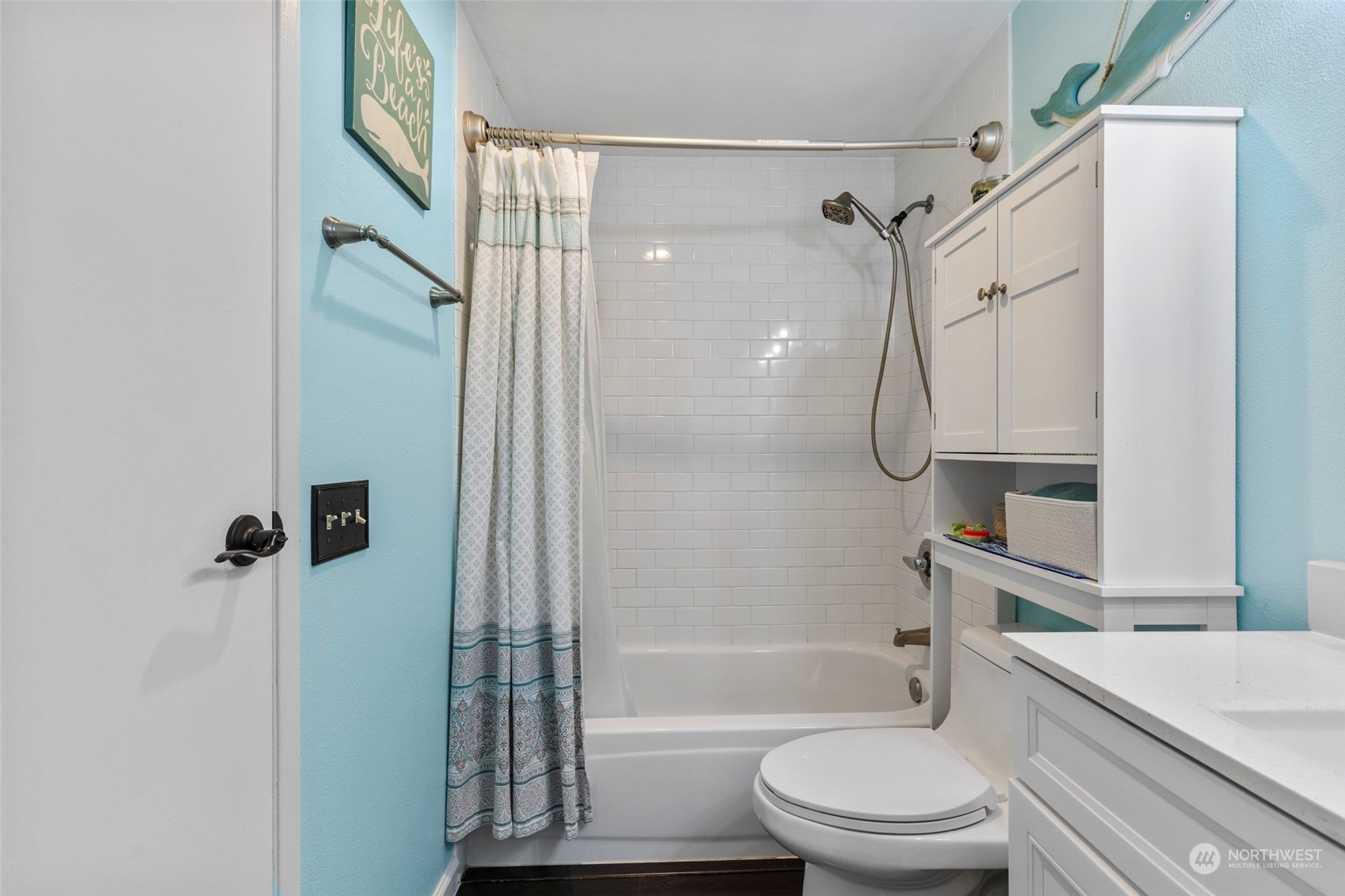 949 Aberdeen Avenue Northeast, Unit E216 Renton, WA 98056 - Photo 17 of 23 a bathroom with a bathtub shower sink vanity and toilet